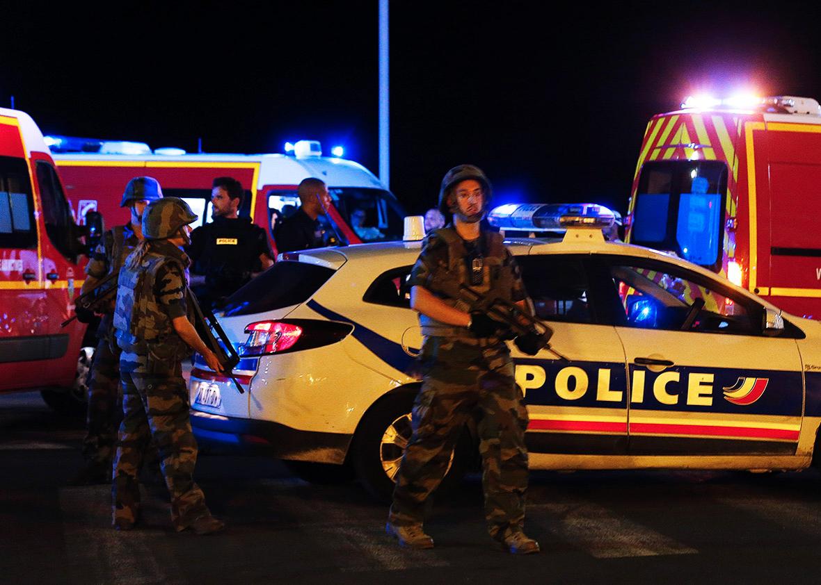 French soldiers and rescue forces are seen at the scene whare at least 30 people were killed in Nice, France, when a truck ran into a crowd celebrating the Bastille Day national holiday July 14, 2016. 
