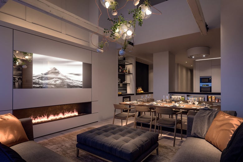 A fancy living and dining room with fireplace and chandelier