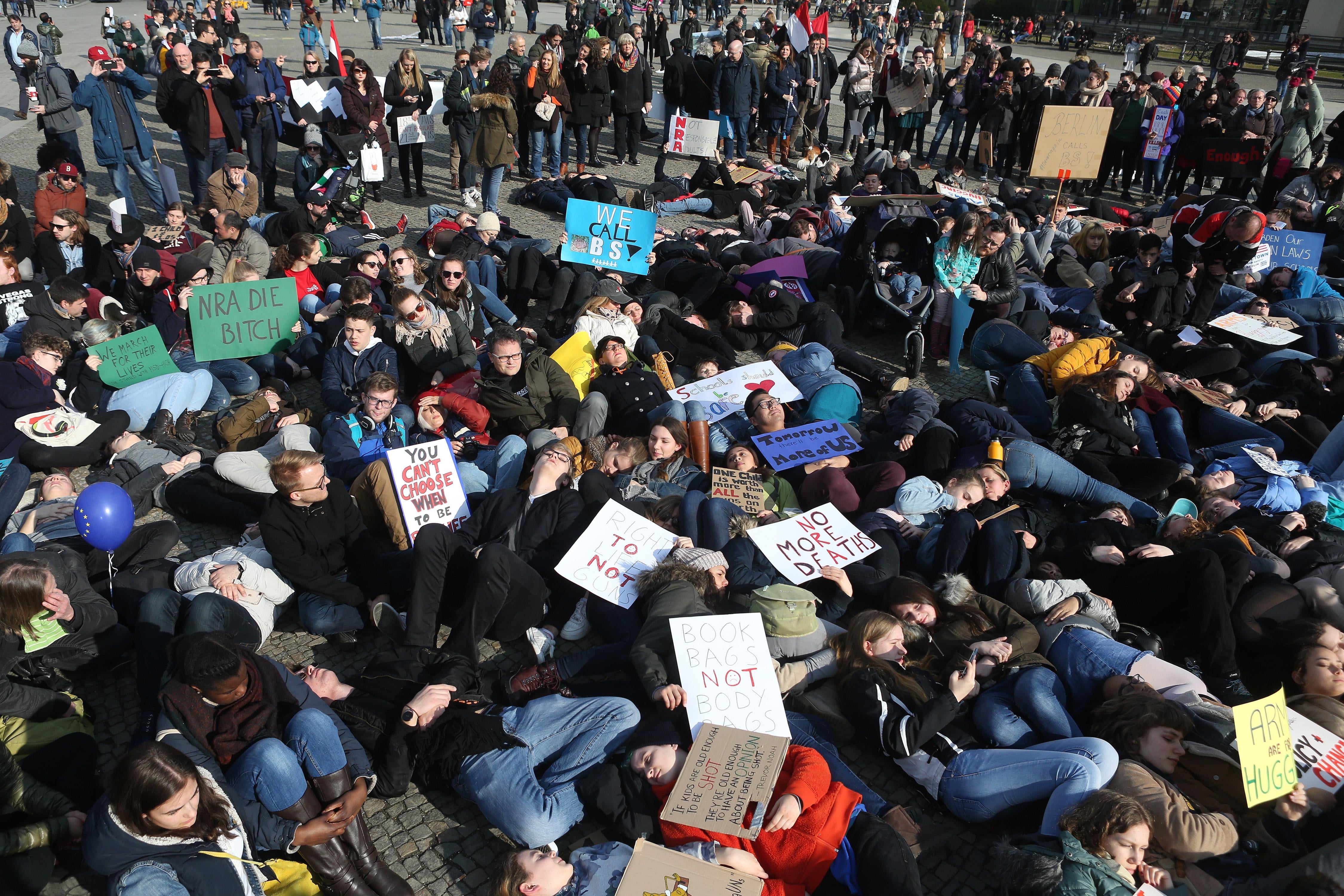 Demonstrators lay on the ground in protest at the March for Our Lives demonstration on March 24, 2018 in Berlin, Germany. 