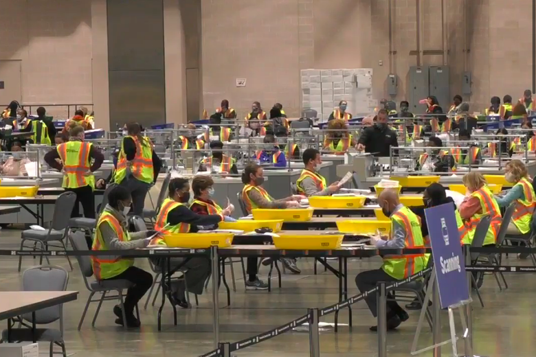 Just a bunch of poll works, sitting in line, doing tedious dull work