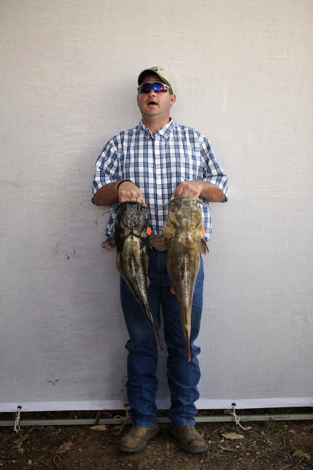 Matt Rainwaters photographs the Okie Noodling Tournament in Pauls