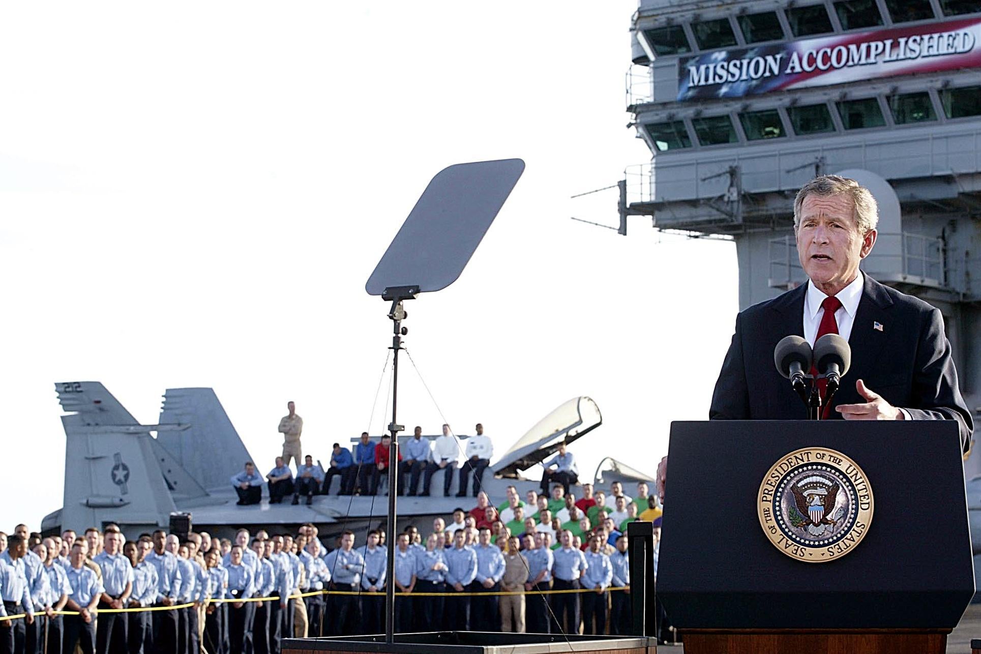 President George W. Bush addresses the nation aboard the nuclear aircraft carrier USS Abraham Lincoln on 1 May, 2003, as it sails for Naval Air Station North Island, San Diego, California. 