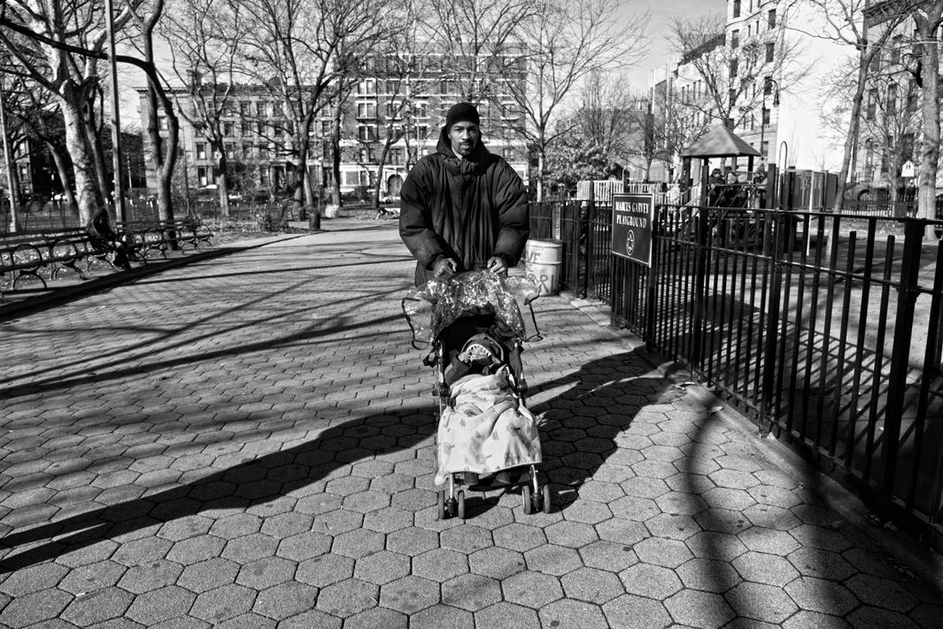 Harlem, NY. 2012. Guy MIller with son Guy Jr. at Marcus Garvey Park. 