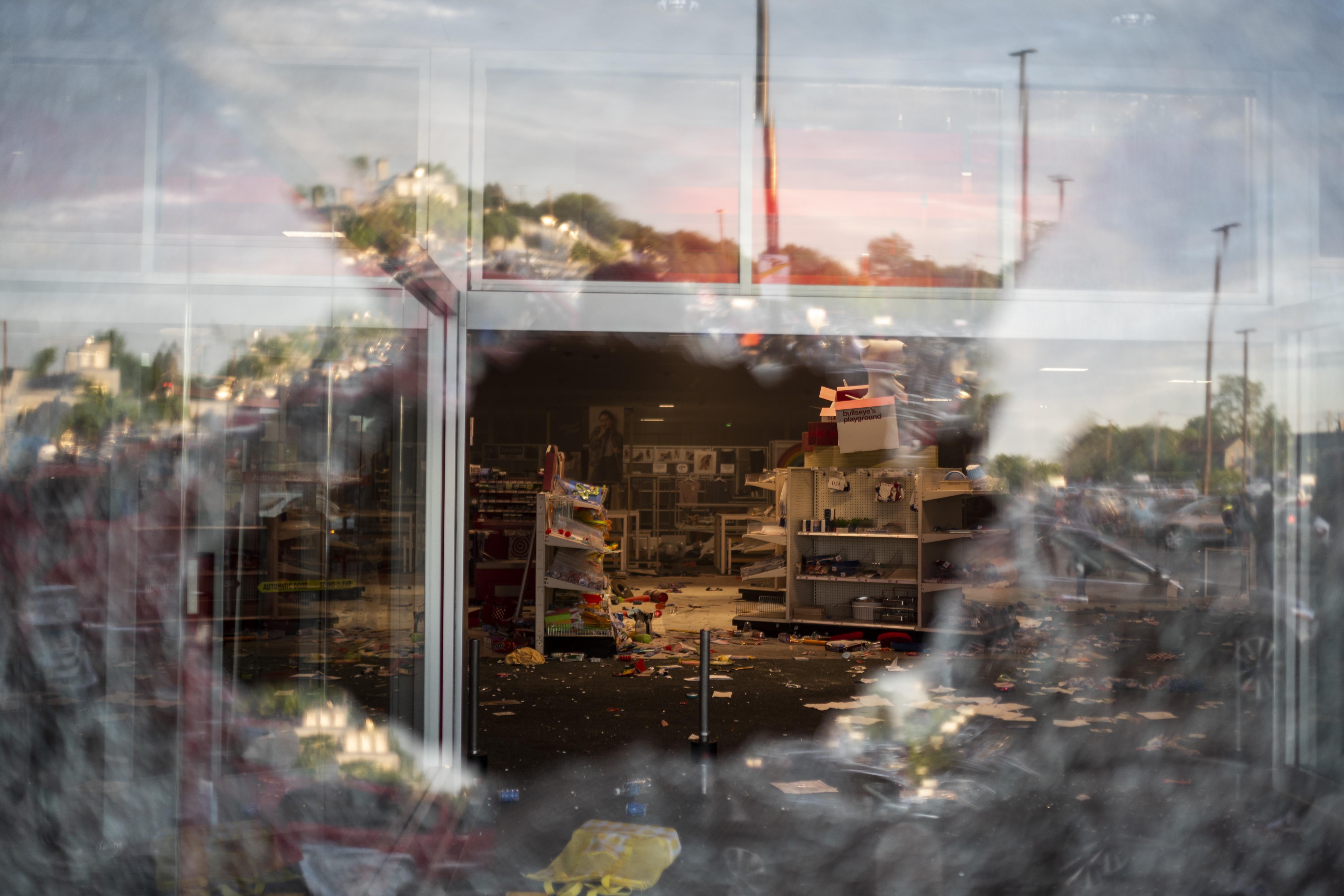  A view inside a Target store through a broken window.
