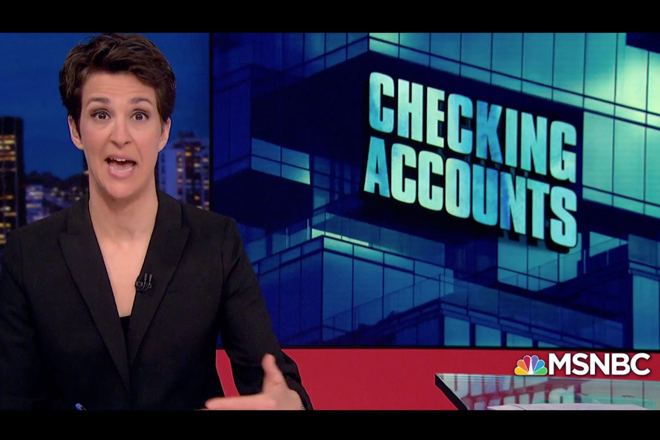 Maddow on her show with the phrase "Checking Accounts" on the screen.