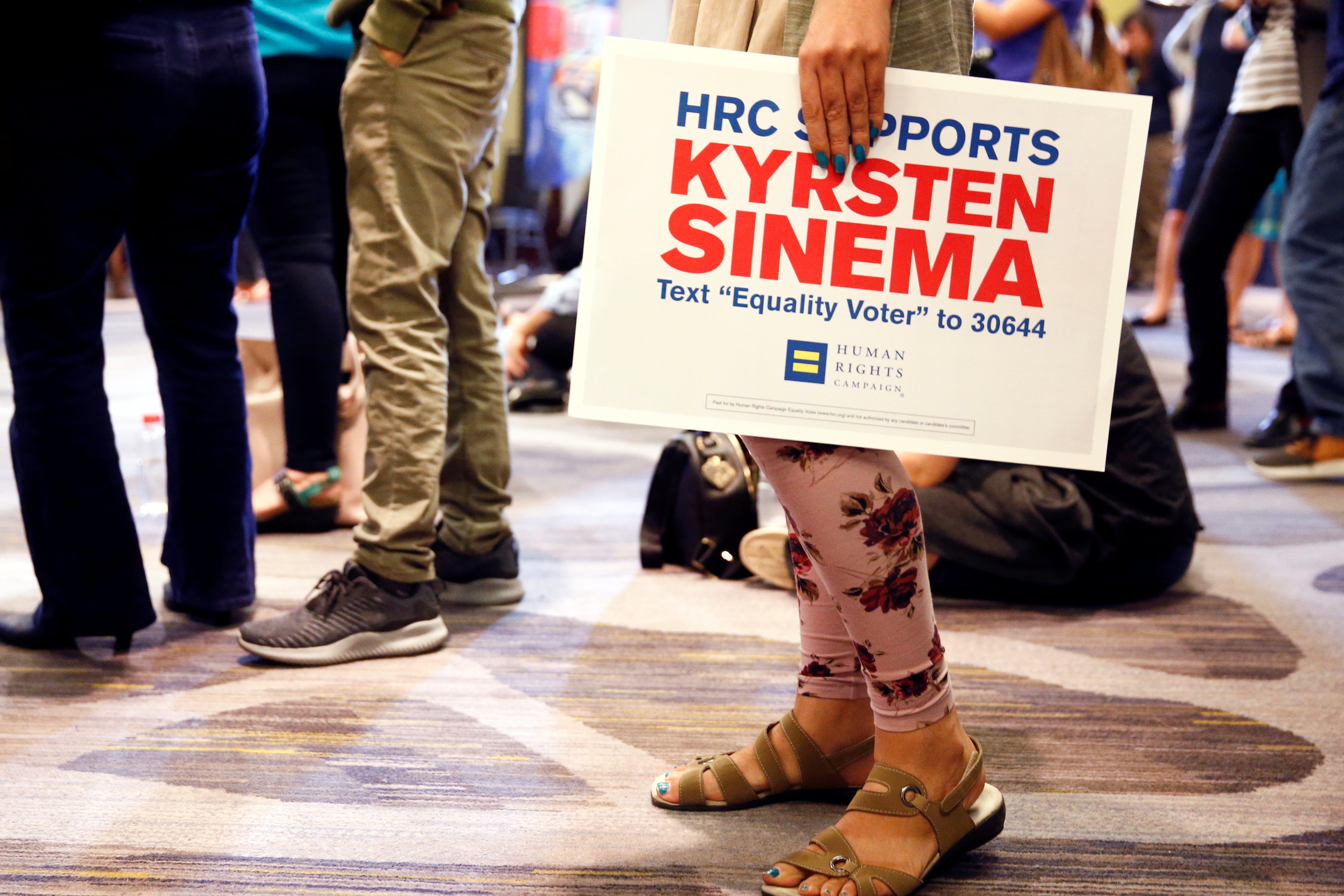 A supporter holds a sign for Kyrsten Sinema at the Arizona Democratic Party Election Night Party in Phoenix, Arizona, U.S. November 6, 2018. 
