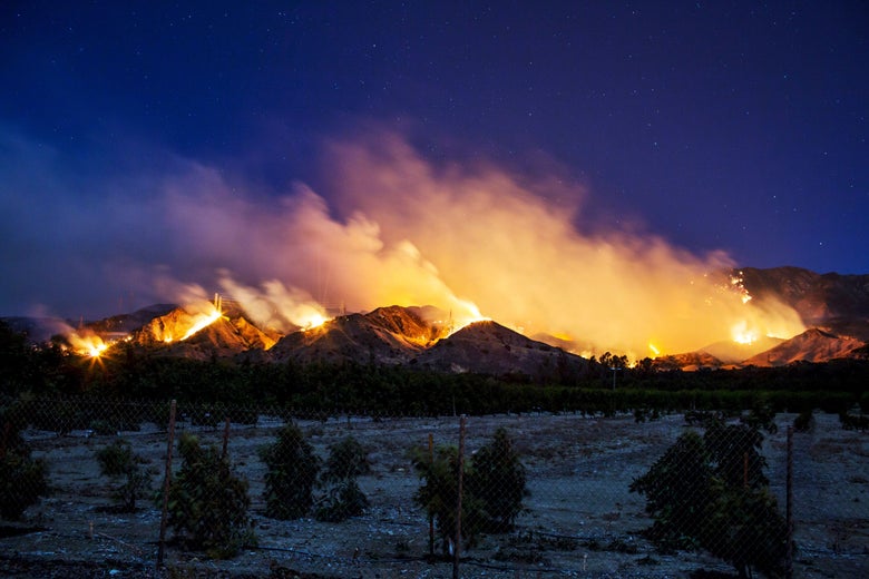 The Thomas Fire burns along a hillside near Santa Paula, California, on December 5, 2017.
More than a thousand firefighters were struggling to contain a wind-whipped brush fire in southern California on December 5 that has left at least one person dead, sent thousands fleeing, and was choking the area with thick black smoke. / AFP PHOTO / Kyle Grillot (Photo credit should read KYLE GRILLOT/AFP/Getty Images)