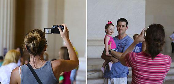 Tourists using their cameras in the Lincoln Memorial.