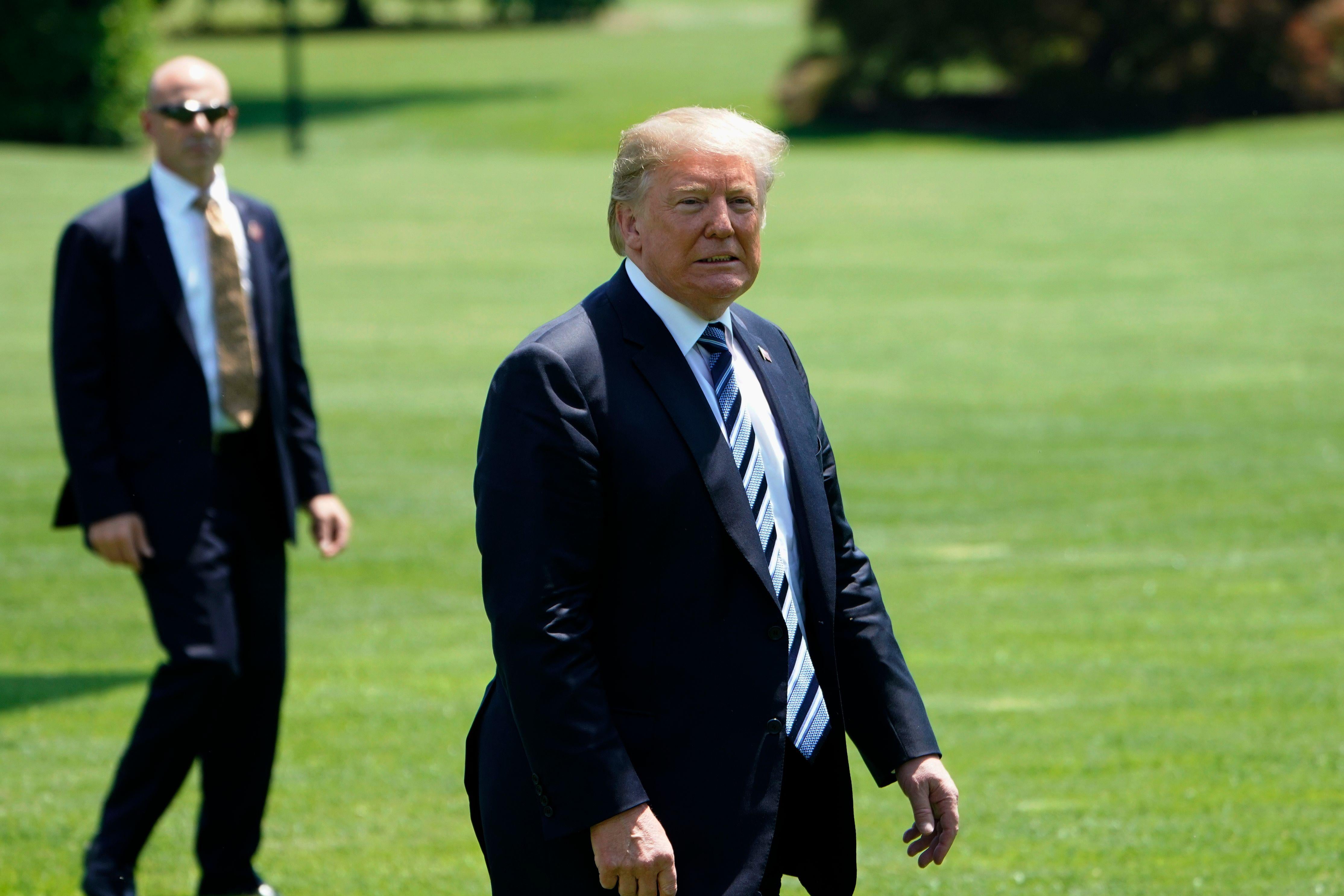 President Donald Trump walks across the South Lawn upon return to the White House on May 25, 2018 in Washington, D.C. 