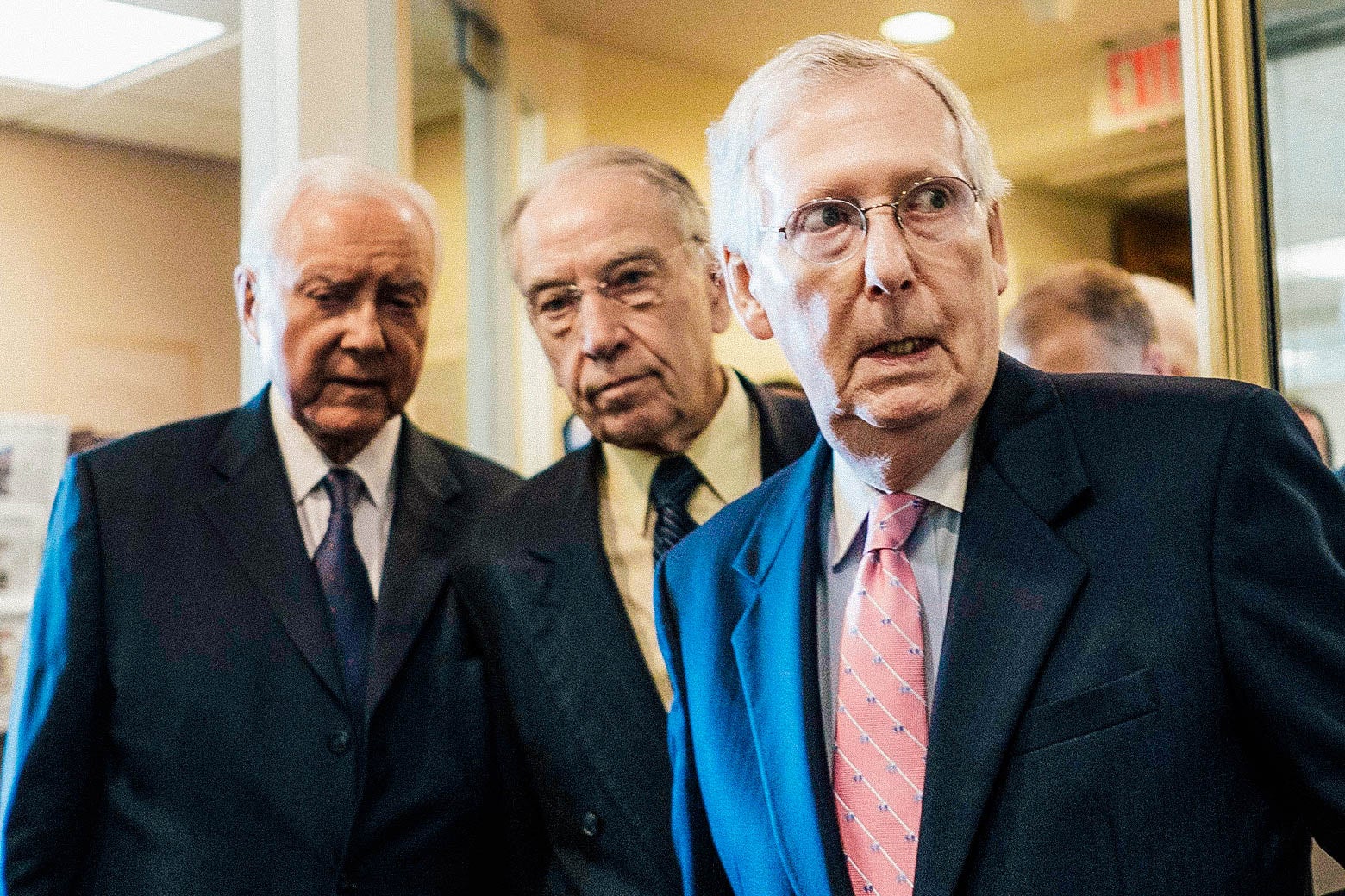 Hatch, Grassley, and McConnell pictured before beginning a press conference.