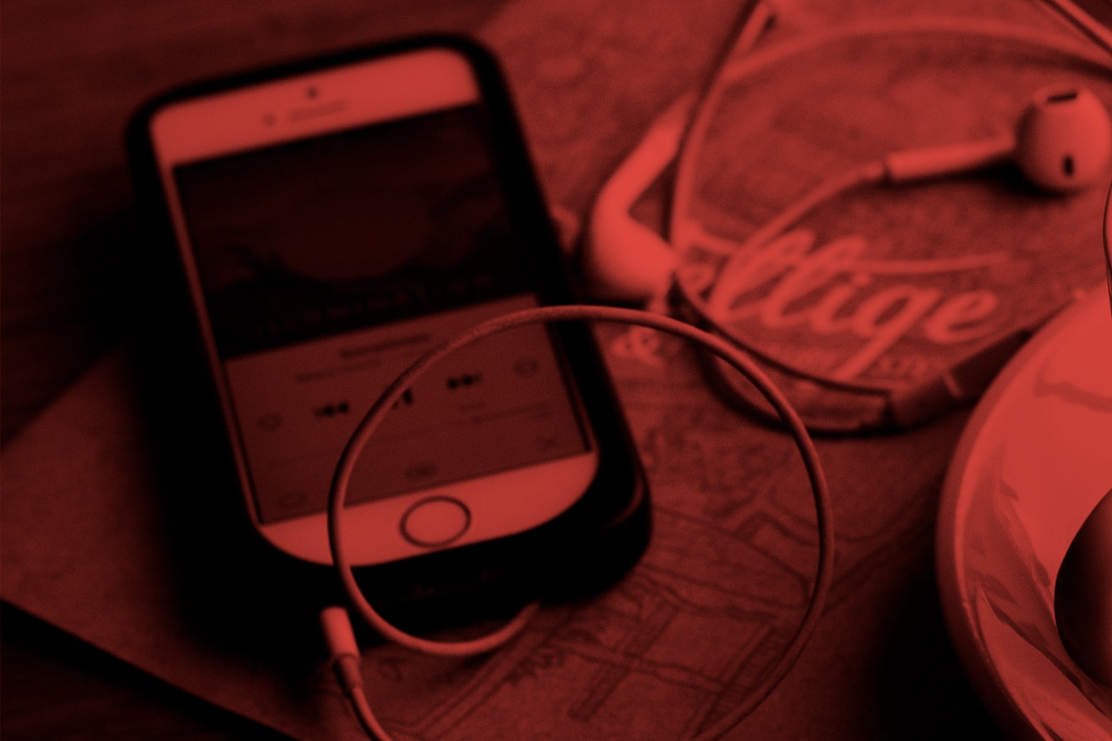 A blood-red-tinted image of an iPhone, headphones in, playing a podcast.