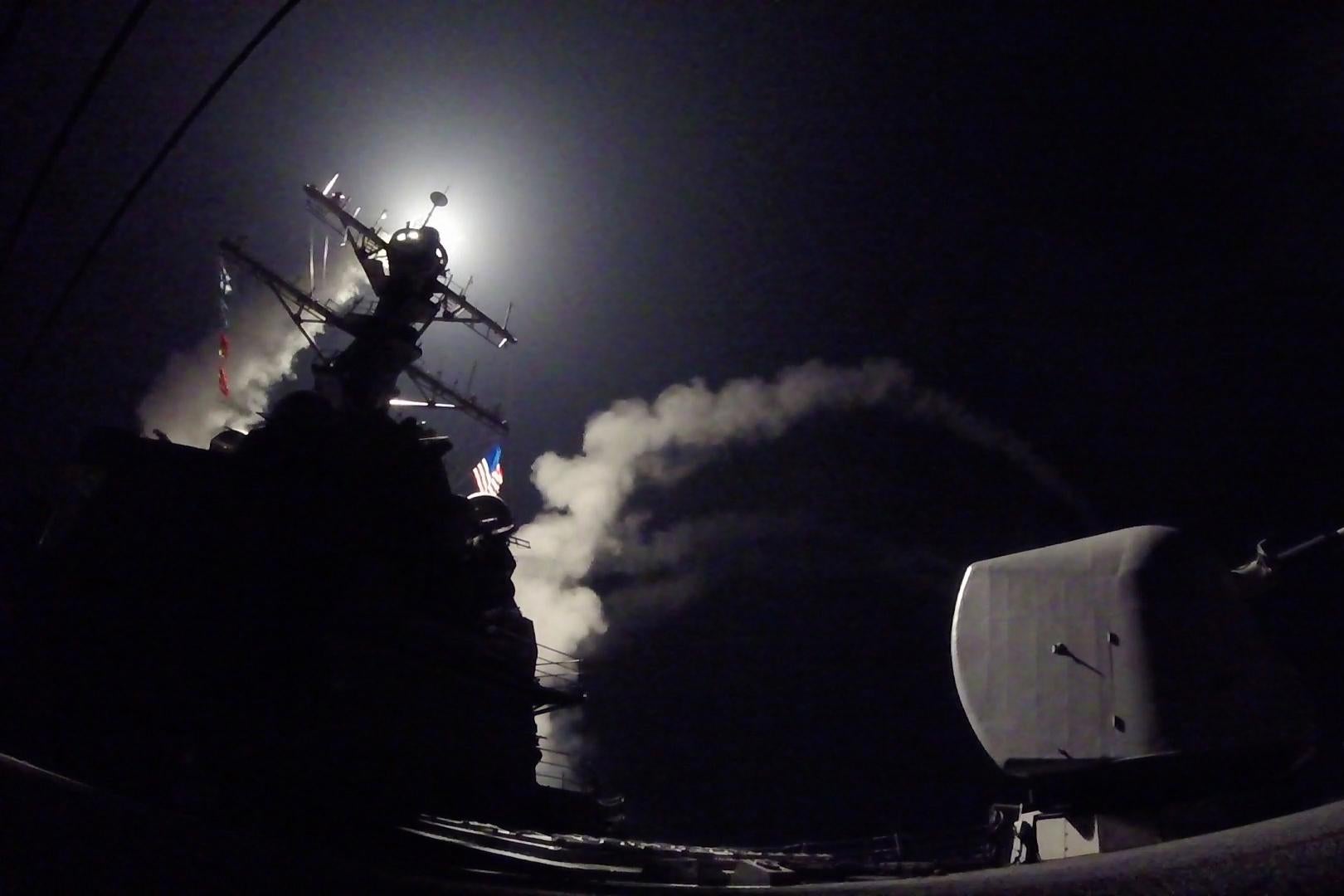 MEDITERRANEAN SEA - APRIL 7:  In this handout provided by the U.S. Navy,The guided-missile destroyer USS Porter fires a Tomahawk land attack missile on April 7, 2017 in the Mediterranean Sea. The USS Porter was one of two destroyers that fired a total of 59 cruise missiles at a Syrian military airfield in retaliation for a chemical attack that killed scores of civilians this week. The attack was the first direct U.S. assault on Syria and the government of President Bashar al-Assad in the six-year war there.  (Photo by Ford Williams/U.S. Navy via Getty Images)