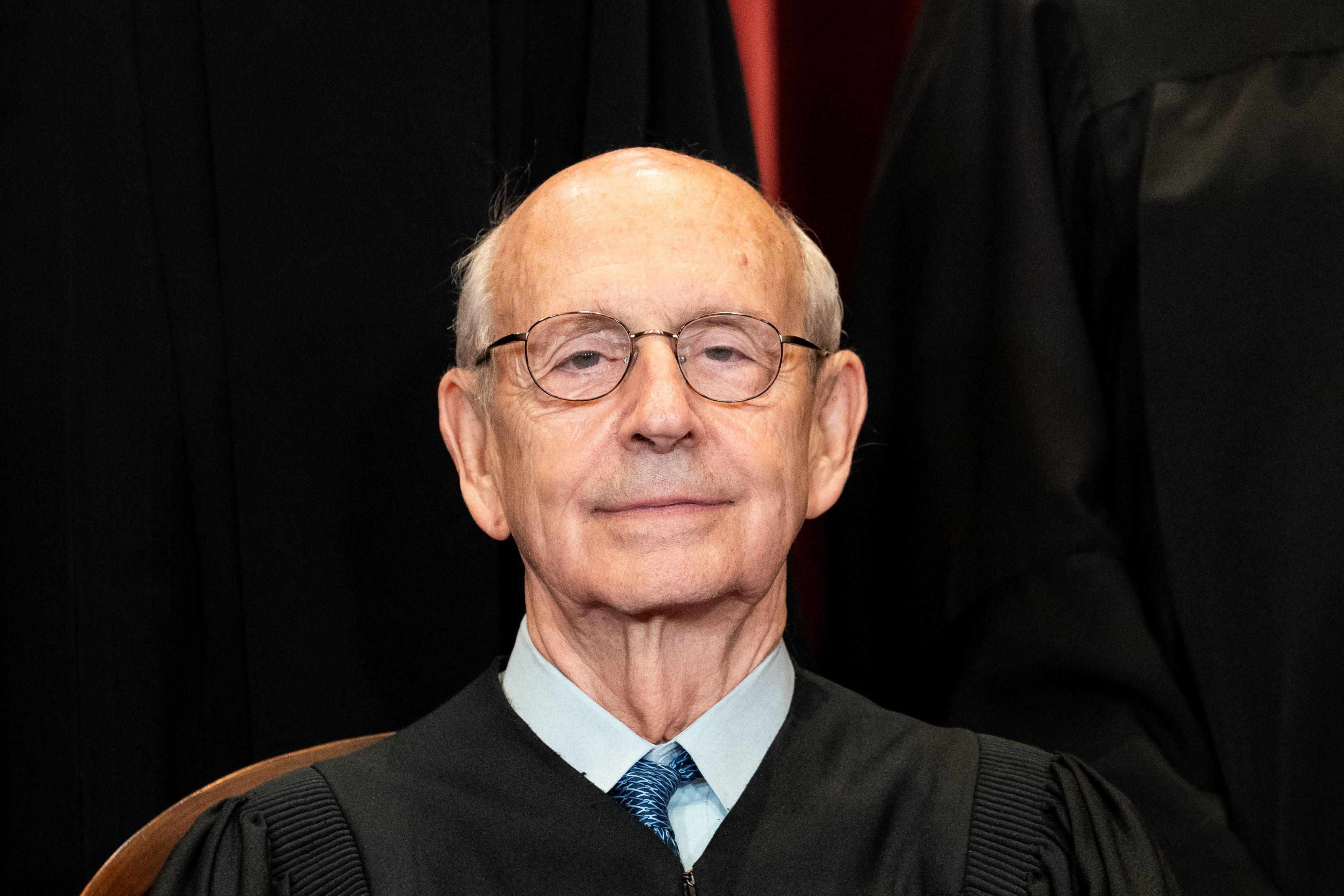 Associate Justice Stephen Breyer wears his robes and sits during a group photo session of the Justices at the Supreme Court in Washington, D.C., on April 23, 2021.
