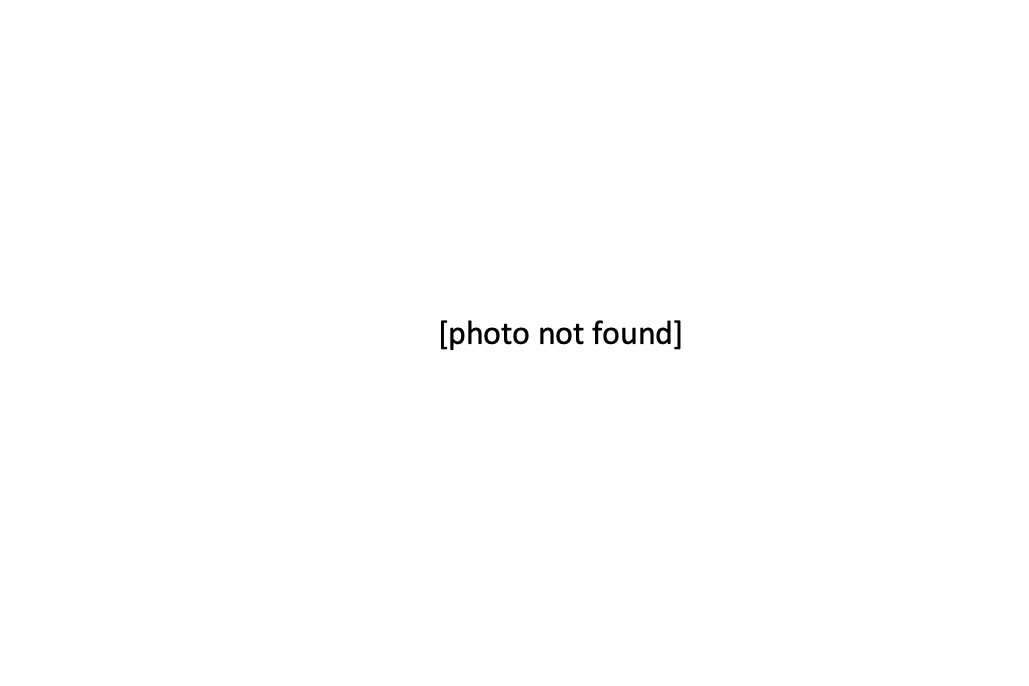 In the middle of blank, white space, black text in brackets reads: "photo not found."