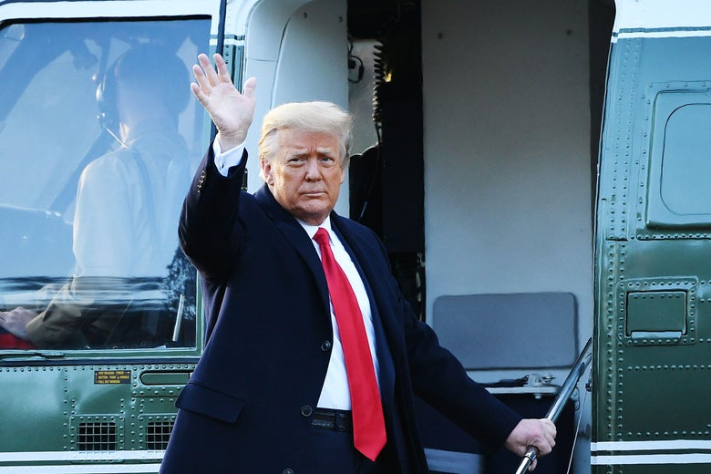 Trump waves from the stairs of a helicopter.