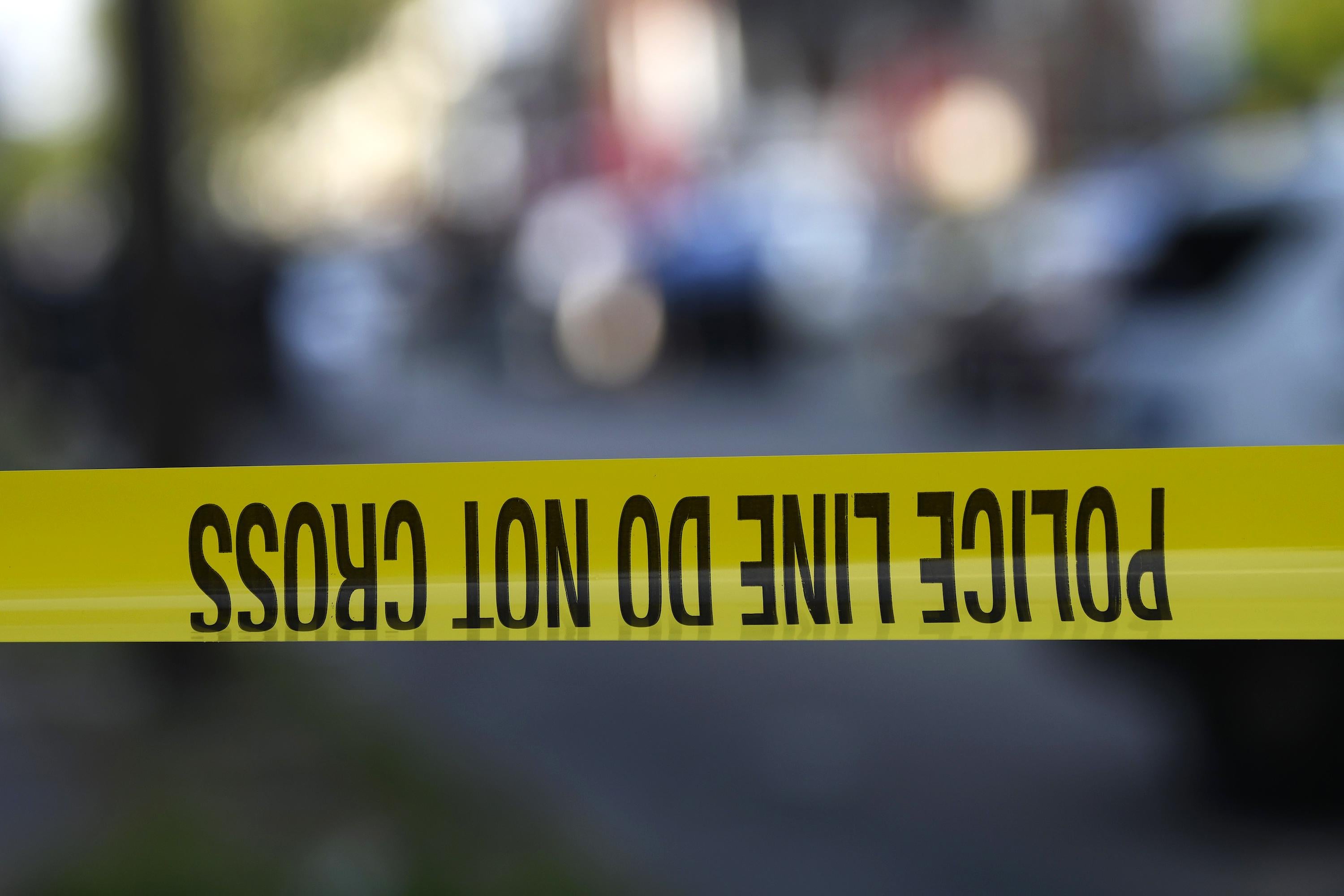 Police tape is stretched across a street near a residence during a shooting on August 14, 2019 in Philadelphia, Pennsylvania. 