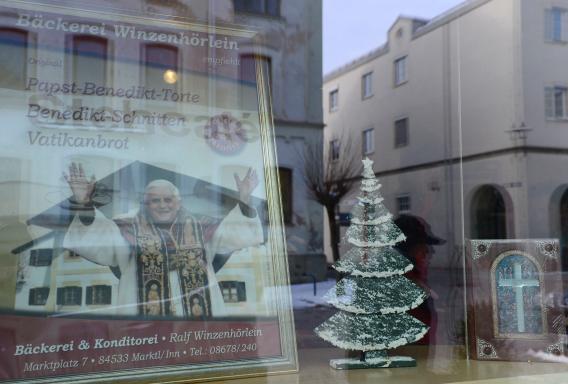 A picture of Pope Benedict XVI is seen behind a window of a bakery in the village Marktl, the birthplace of Pope Benedict XVI.