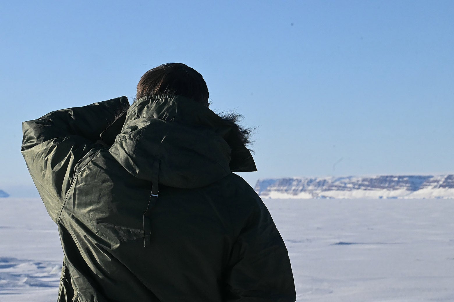 JD Vance looking at a barren land of snow.