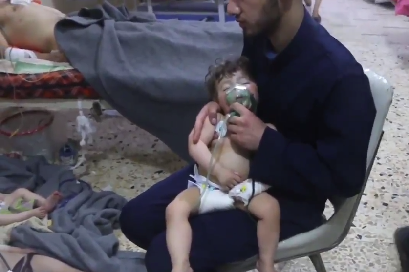 This screenshot from video released by the Syrian Civil Defense, known as the White Helmets, reportedly shows medical workers treating toddlers following the alleged chemical town in Douma, in eastern Ghouta, near Damascus, Syria. 