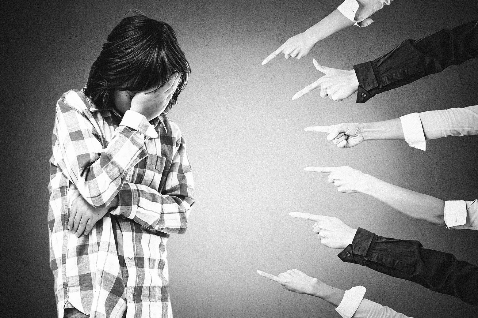 A male-identifying child being pointed at and shamed.