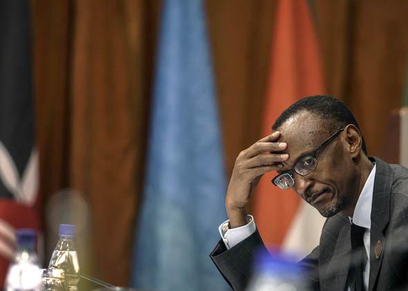 Rwanda's President Paul Kagame listens to deliberations during the International Conference on the Great Lakes Region (ICGLR) in the Ugandan capital of Kampala August 8, 2012. 