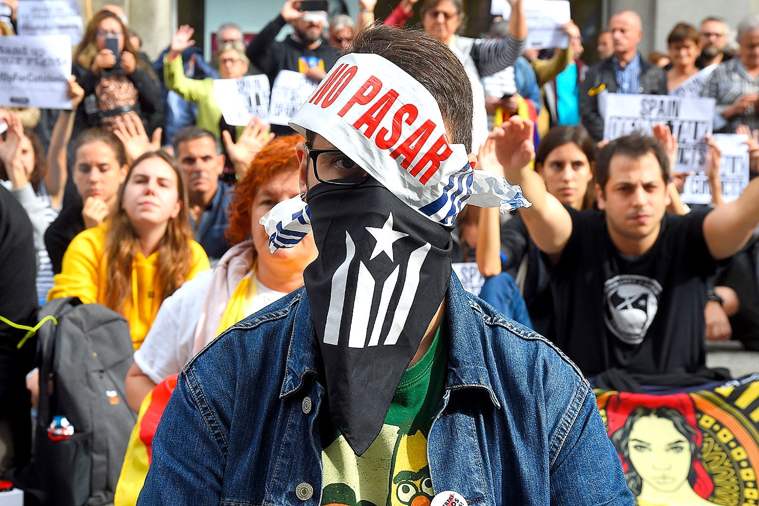A masked demonstrator in Barcelona on Wednesday.