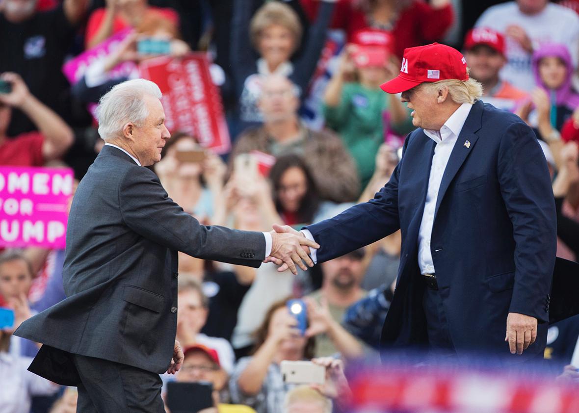 President-elect Donald Trump greets Senator Jeff Sessions, Trump's picks for attorney general, during a thank you rally in Ladd-Peebles Stadium on December 17, 2016 in Mobile, Alabama. 