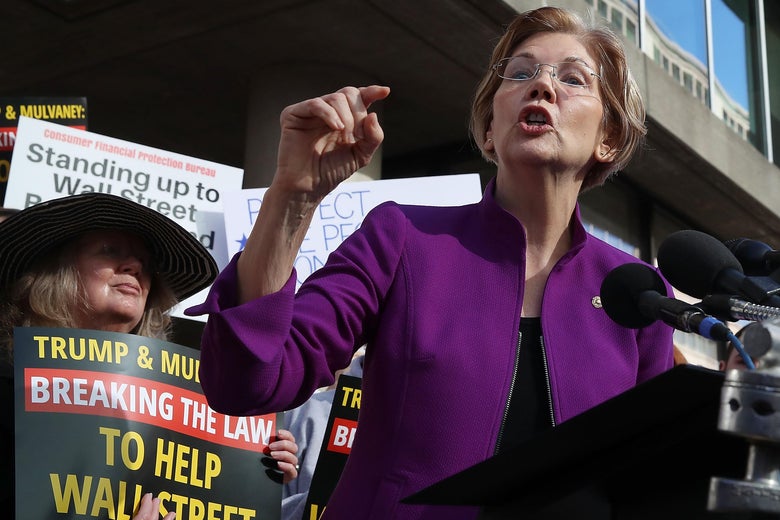 WASHINGTON, DC - NOVEMBER 28:  Sen. Elizabeth Warren (D-MA) speaks during a protest in front of the 
Consumer Financial Protection Bureau (CFPB) headquarters on November 28, 2017 in Washington, DC. Sen. Warren is demanding that Mick Mulvaney step aside and let acting CFPB director Leandra English do her job. President Trump named Office of Management and Budget (OMB) Director Mick Mulvaney to replace outgoing CFPB Director Richard Cordray.  (Photo by Mark Wilson/Getty Images)