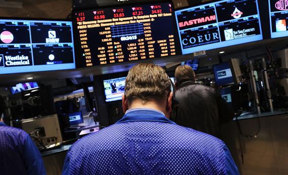 Traders work on the floor of the New York Stock Exchange.