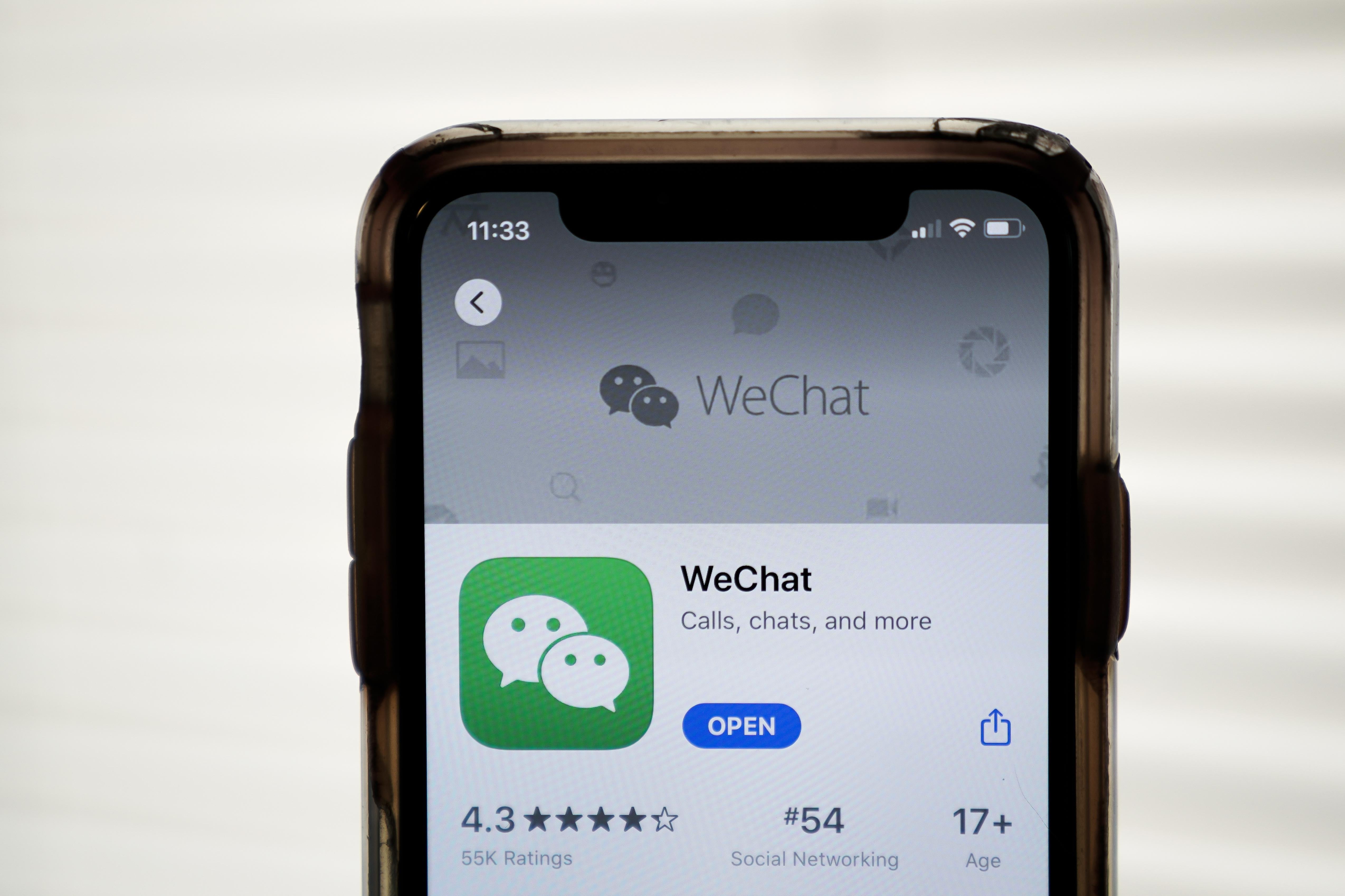 An iPhone showing WeChat in the App Store.