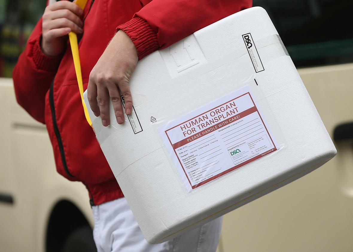 A driver carries an empty styrofoam box used for transporting human organs to his van at the Vivantes Neukoelln clinic on September 28, 2012 in Berlin, Germany. 