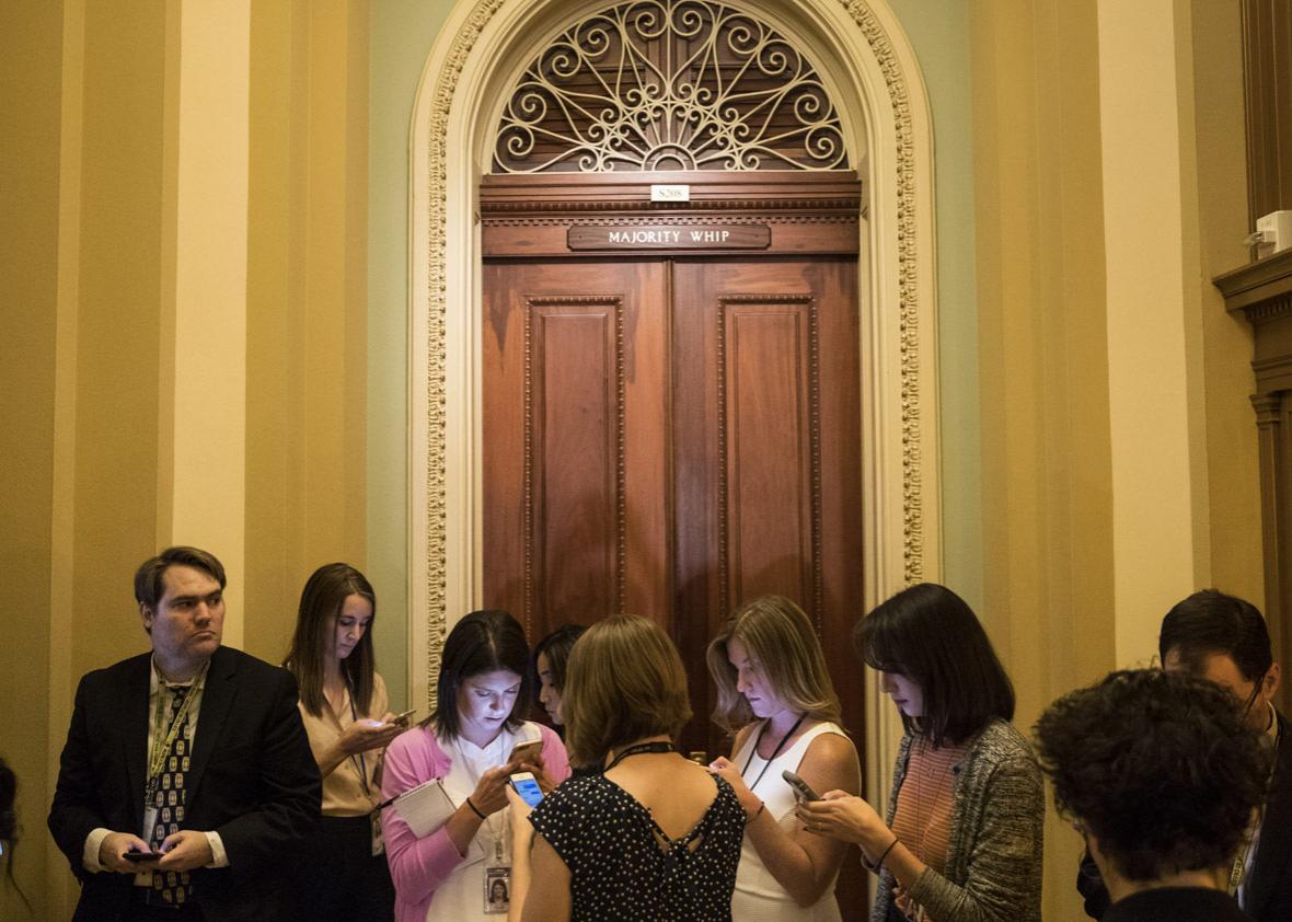 Reporters wait for Senators to emerge from the office of Sen. John Cornyn (R-TX) on Capitol Hill, June 27, 2017