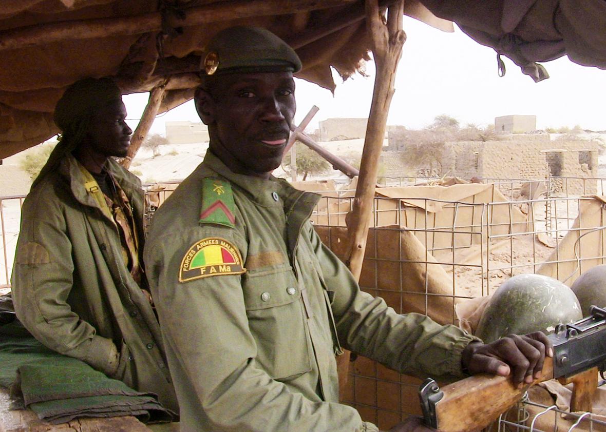Malian soldiers stand guard on May 2, 2016 in Timbuktu, northern Mali.