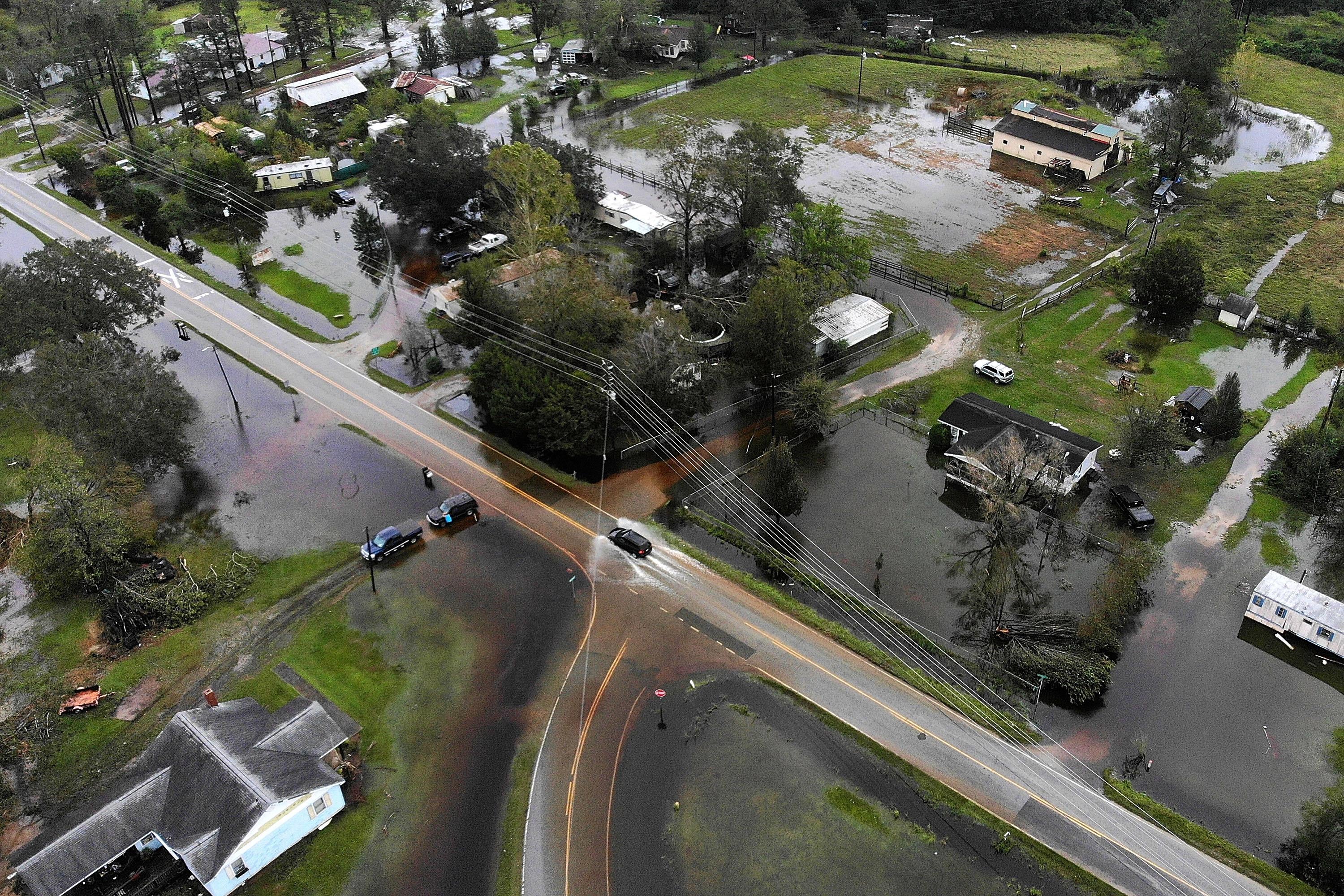 An aerial image of flooded roads and houses.