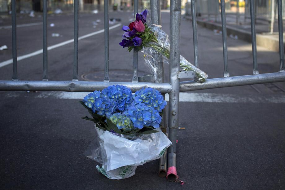 Flowers are seen at the barricaded entrance at Boylston Street near the finish line of the Boston Marathon in Boston.