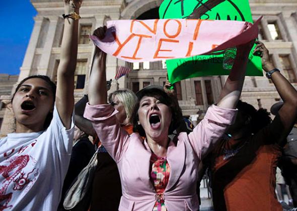 Pro-choice protester Julia Ann Nitsch, center, chants during a rally at the Texas state capitol over controversial abortion legislation in July 2013 in Austin, Texas