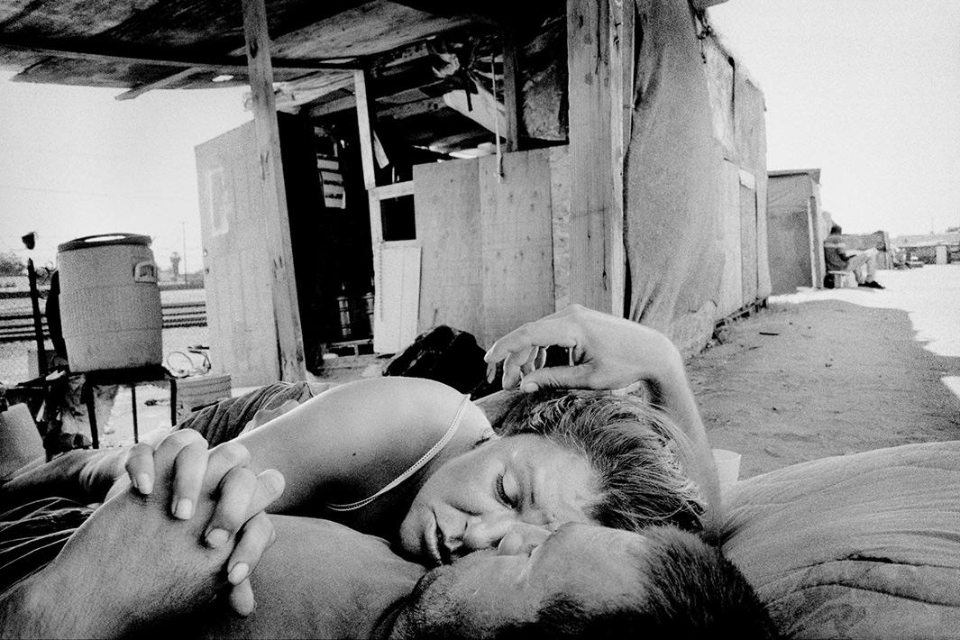 A couple outside their shanty, Fresno, California.