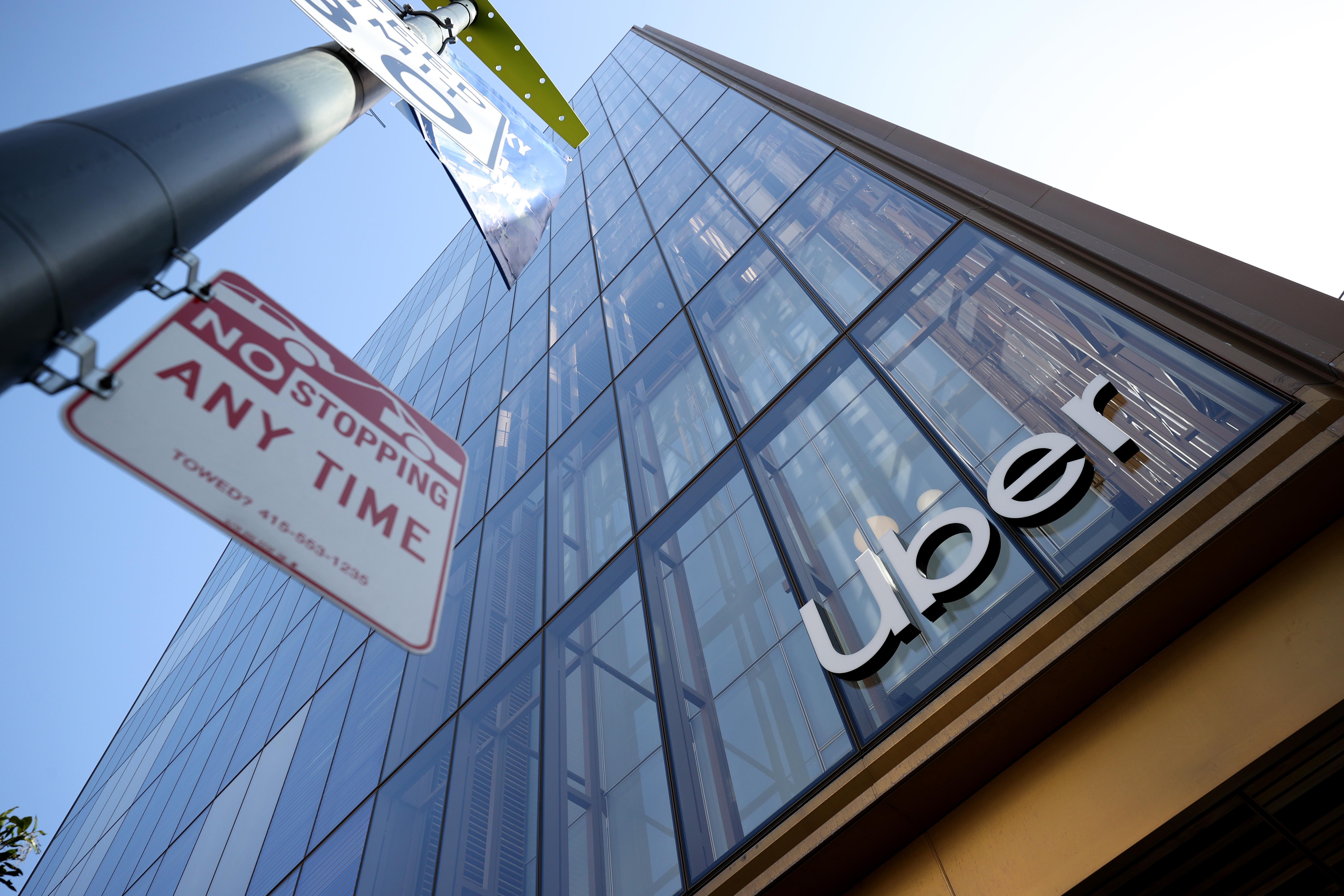 A sign is posted on the exterior of the new Uber headquarters on March 29, 2021 in San Francisco, California. Uber is allowing some employees to return to work at their newly opened headquarters that was completed during the pandemic. San Francisco has entered the orange tier of reopening which allows non-essential offices to open at 25% capacity. (Photo by Justin Sullivan/Getty Images)