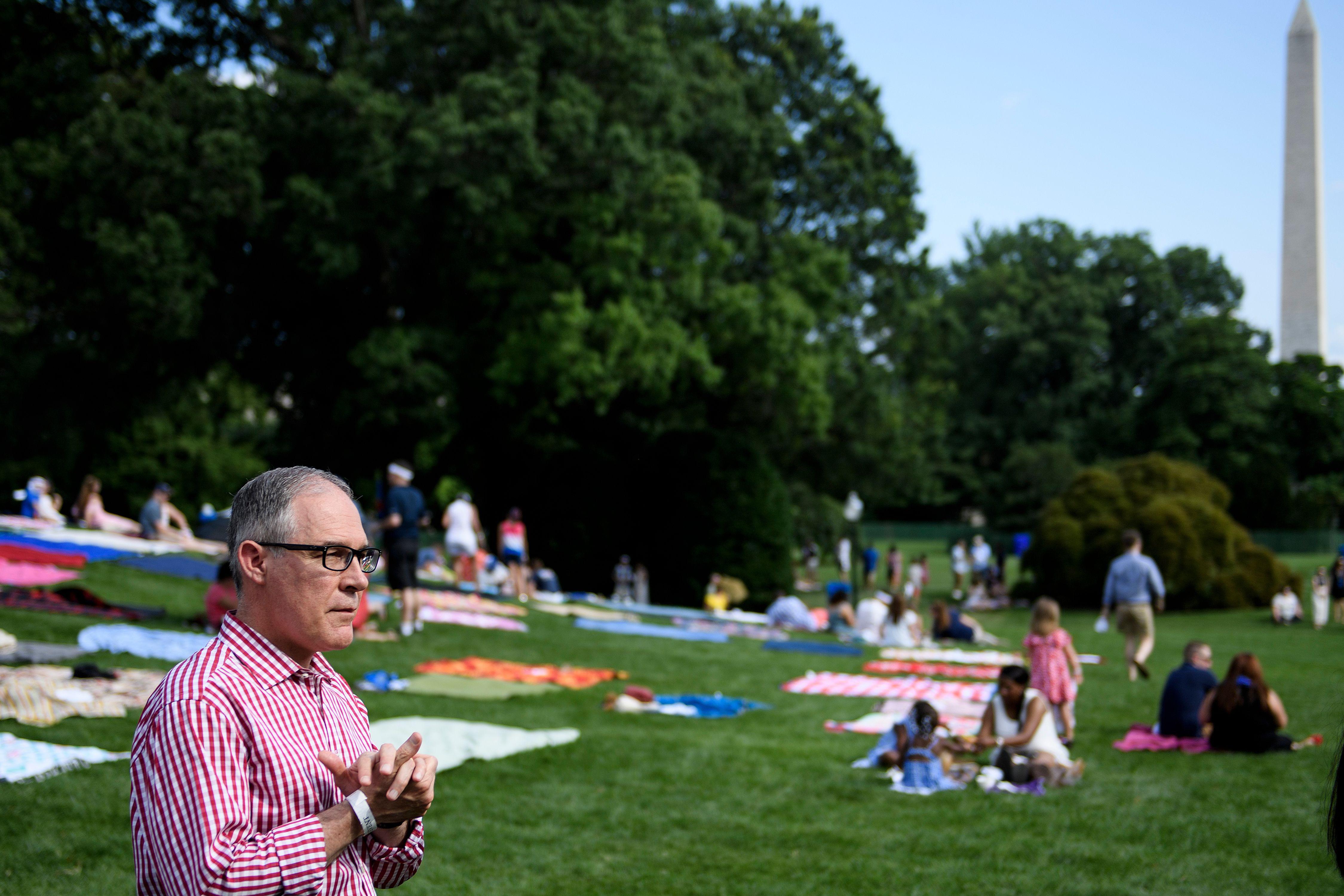 Former EPA administrator Scott Pruitt walks during a picnic for military families on the South Lawn of the White House July 4, 2018 in Washington, DC. 