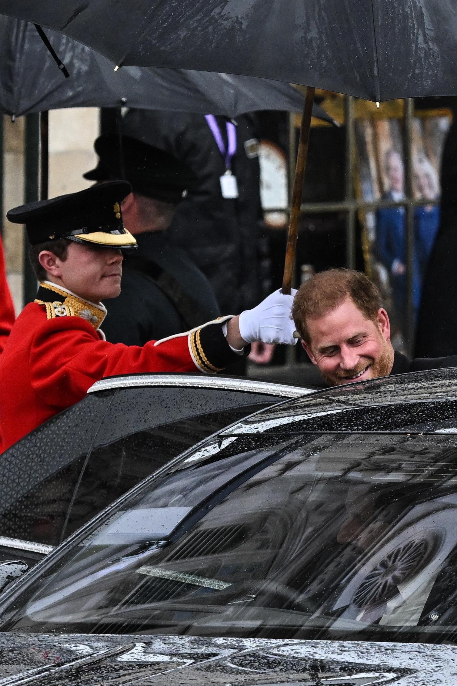 Britain's Prince Harry, Duke of Sussex leaves Westminster Abbey after the Coronation Ceremonies of Britain's King Charles III and Britain's Queen Camilla in central London on May 6, 2023. - The set-piece coronation is the first in Britain in 70 years, and only the second in history to be televised. Charles will be the 40th reigning monarch to be crowned at the central London church since King William I in 1066. Outside the UK, he is also king of 14 other Commonwealth countries, including Australia, Canada and New Zealand. (Photo by Paul ELLIS / AFP) (Photo by PAUL ELLIS/AFP via Getty Images)