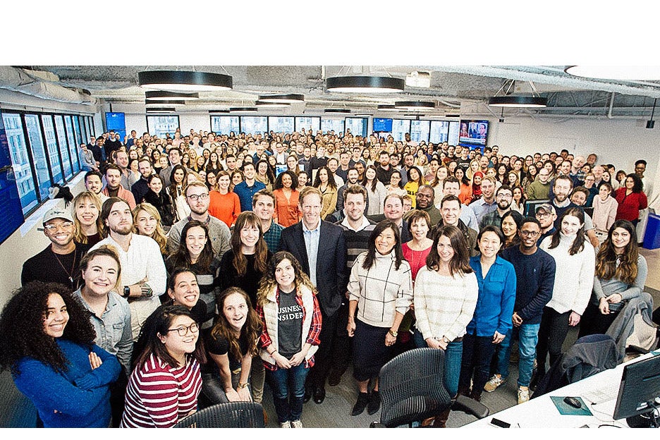 Insider Inc. staff crowded in the Insider newsroom.