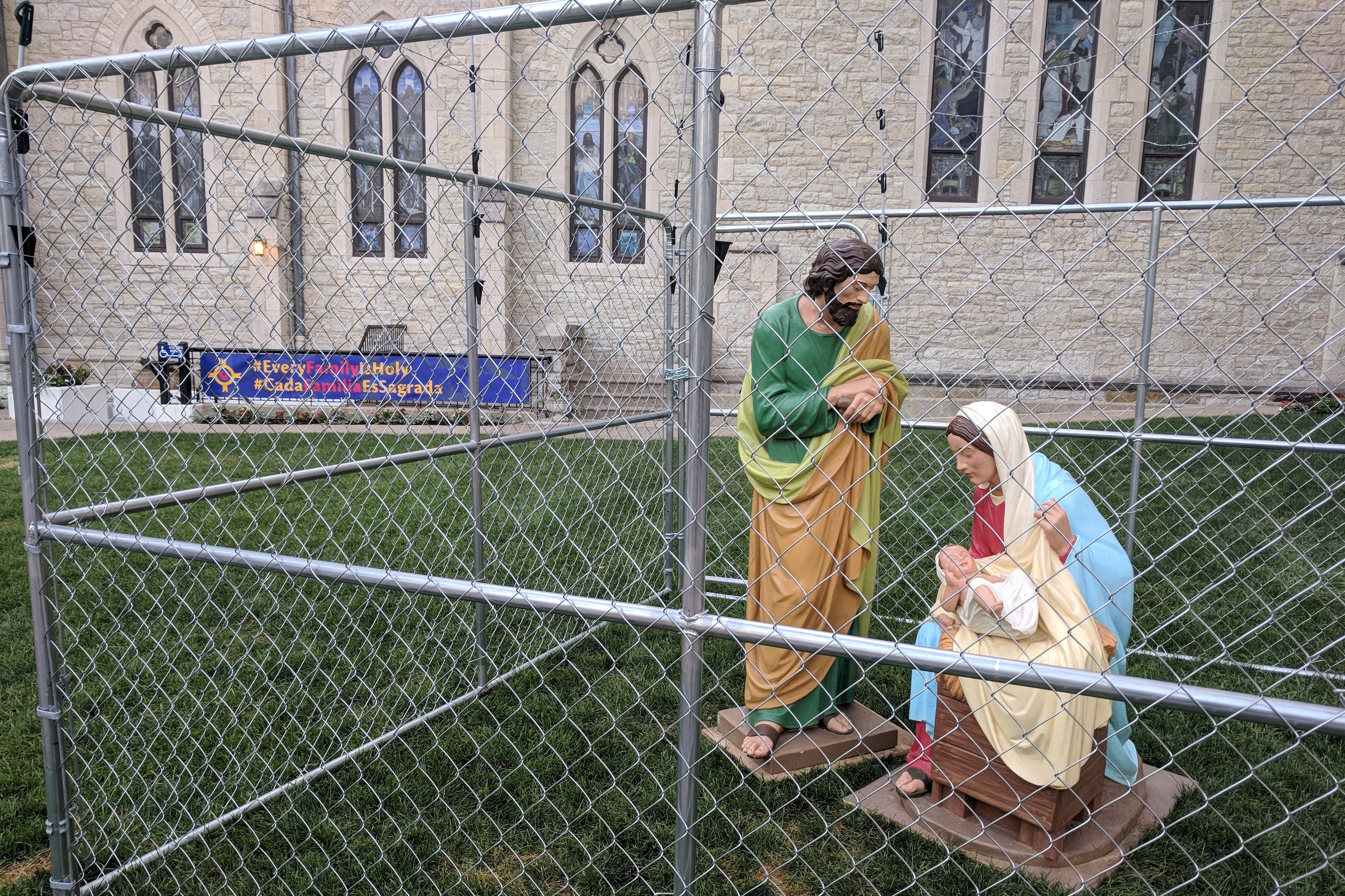 The statues of Jesus, Mary, and Joseph are seen in a cage as a protest of child separation policy, in Indianapolis, Indiana on July 2, 2018.