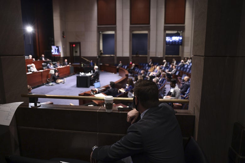 People seated in a hearing room