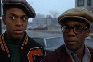 Two young men in letter jacket and sweater, from Cooley High.