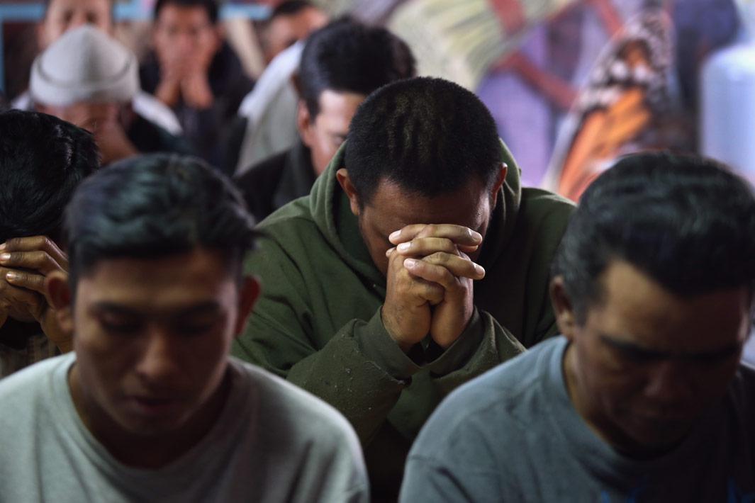 Nogales, Mexico Immigrants pray during a Catholic Mass held at the Kino Border Initiative center for migrants March 10, 2013 near the U.S.-Mexico border in Nogales, Mexico. The center feeds hundreds of meals per day to immigrants recently deported from the United States and those about to attempt to cross into the U.S. illegally.  