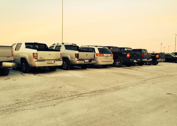 Sarah Kovaleski's minivan parked among pickup trucks.