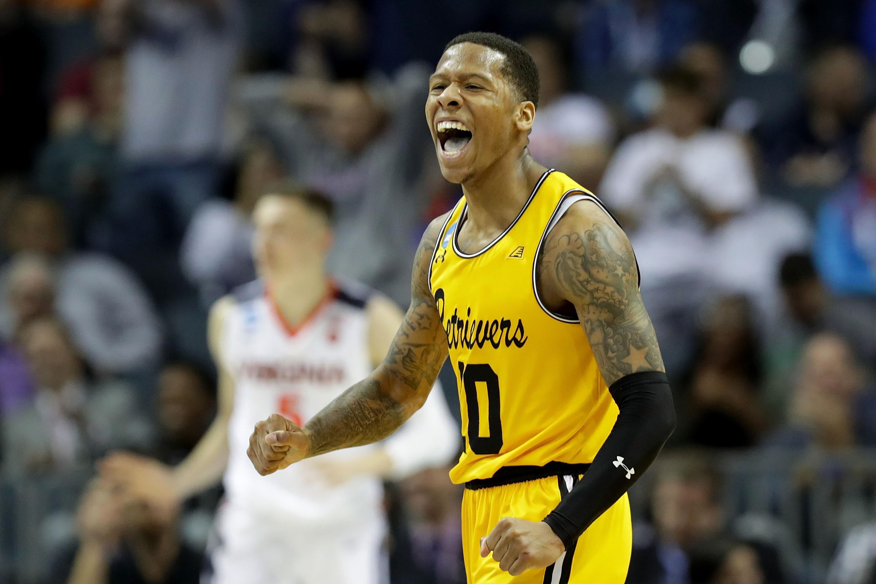 CHARLOTTE, NC - MARCH 16:  Jairus Lyles #10 of the UMBC Retrievers reacts after a score against the Virginia Cavaliers during the first round of the 2018 NCAA Men's Basketball Tournament at Spectrum Center on March 16, 2018 in Charlotte, North Carolina.  (Photo by Streeter Lecka/Getty Images)