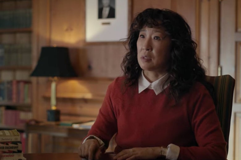 Dr. Kim sits in a chair in a fancy-looking office.