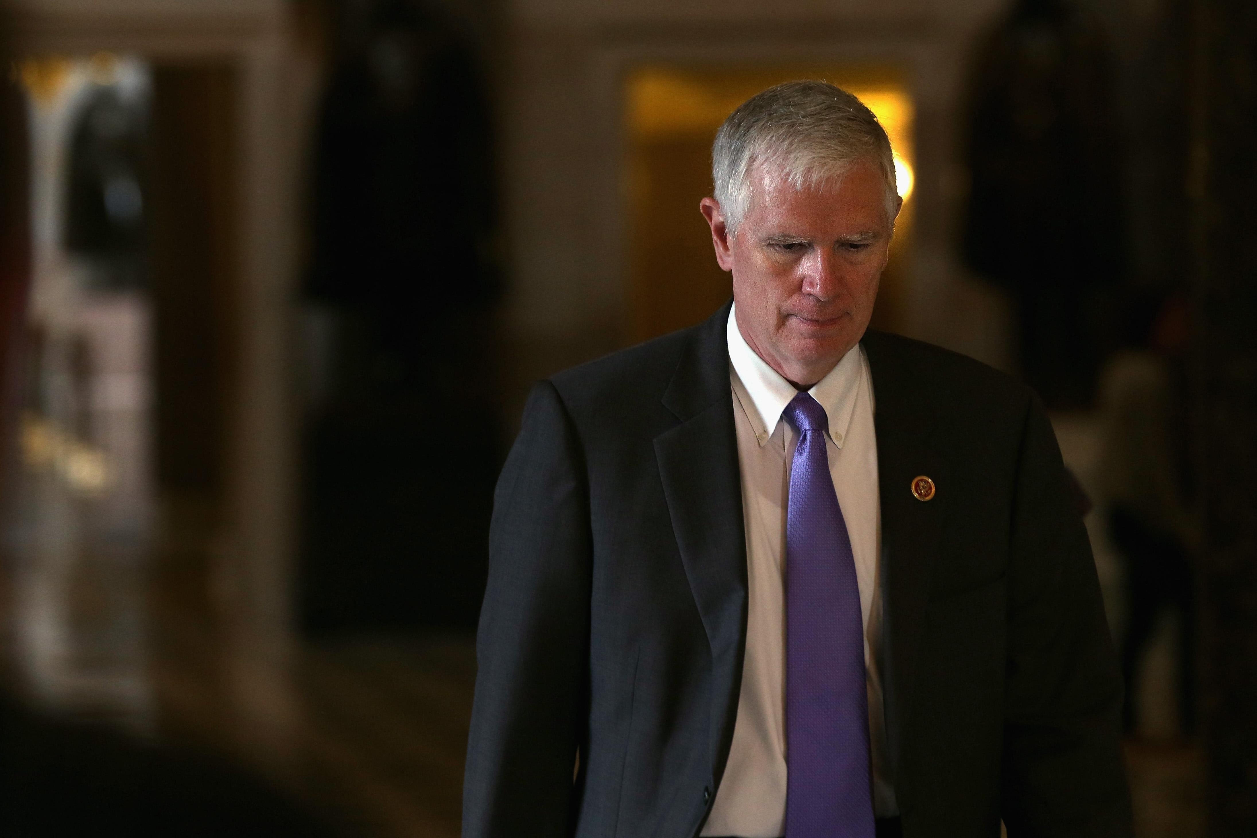 Mo Brooks casts his eyes downward as he walks in the Capitol.