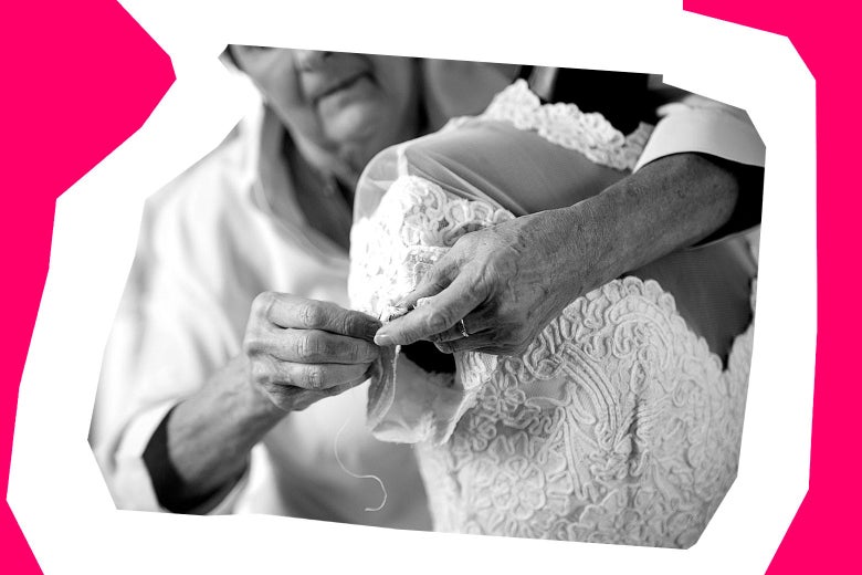 A woman sewing a wedding dress.